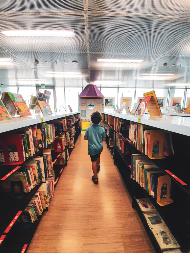 Adam exploring the children's library